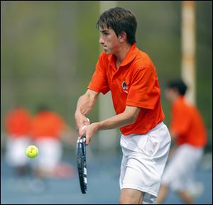 Sylvania Southview player Michael Burchfield returns a shot during his second singles championship match.