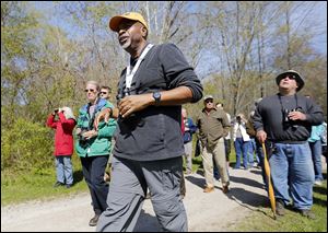 Doug Gray of Franklin, Ind., leads a birding-themed guided walk at Swan Creek Metropark. Most of the Biggest Week in American Birding’s sites are in Ottawa County, but Lucas County businesses also are seeing a boost. 