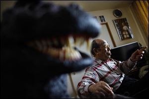 Original Godzilla suit actor Haruo Nakajima, who has played his role as the monster, speaks during an interview at his home in Sagamihara, near Tokyo. Nakajima, 85, was a stunt actor in samurai films, when he was approached to take the Godzilla role. He had to invent the character from scratch, and went to the zoo to study the way elephants and bears moved. 