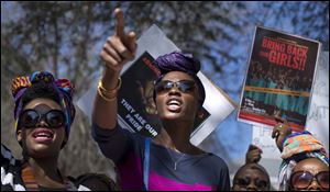 South Africans protest in solidarity against the abduction three weeks ago of hundreds of schoolgirls in Nigeria by the Muslim extremist group Boko Haram and what protesters said was the failure of the Nigerian government and international community to rescue them, during a march to the Nigerian Consulate in Johannesburg, South Africa, Thursday.