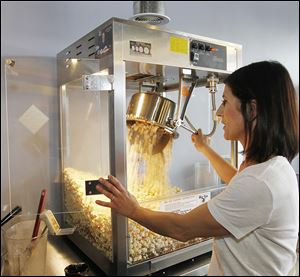 Rachel Marciniak-Matthews makes popcorn in 30 flavors in her Rachel Michael’s  Gourmet Popcorn store on Monroe Street. She used to sell her popcorn from her home and online.