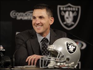 Oakland Raiders coach Dennis Allen speaks during a news conference.