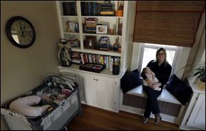 Abigail Ernst poses with her 2-month-old daughter, Lucy, in their Oldwick, N.J. home. Ms. Ernst and her husband, Ken Ernst, conceived Lucy by using only one embryo through in vitro fertilization. Since 1992, clinics have been required to report their success rates, defined as the number of live births per in vitro fertilization cycle, to the Centers for Disease Control and Prevention.