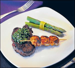 Steak with chimichurri, asparagus, blackened shrimp. 