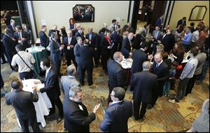  Italian and American businessmen mingle at Italian Business Forum in Toledo on Monday night.