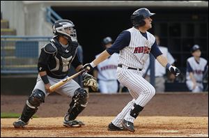 Jordan Lennerton hits a three-run double for Toledo against Syracuse during Tuesday’s game. The Mud Hens had 18 total hits.
