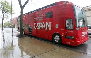  The  C-SPAN bus sits outside the Toledo Club.