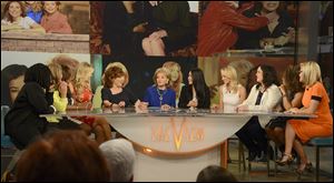 Past and present ‘View’co-hosts, from left, Whoopi Goldberg, Meredith Vieira, Star Jones, Debbie Matenopoulos, Joy Behar, Barbara Walters, Lisa Ling, Elisabeth Hasselbeck, Rosie O'Donnell, Sherri Shepherd, and Jenny McCarthy chat on the set of the daytime talk show in New York. 