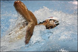 Michael Phelps swims the 200 freestyle in a preliminary event at the Arena Grand Prix swim meet in Charlotte, N.C. today.
