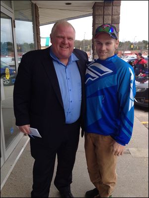 Toronto Mayor Rob Ford is still in rehab, his lawyer said Friday as photos of the mayor posing with residents in Ontario's cottage country were posted online.