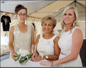 From left, Susan Park, Kim Kaplan, and Mary-Bec Gwyn at Treo Restaurant during last year's Summer in Paris fund-raising event for the Beach House Family Shelter in Sylvania.