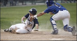 Napoleon‘s Zach Willeman is tagged out at home by Anthony Wayne catcher D.J. Komisarek. The Generals improved to 16-8 overall, 9-3 in the NLL.