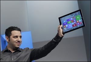 Panos Panay, Microsoft’s vice president for surface computing, introduces the Surface Pro 3 tablet device at a media preview Tuesday in New York. The device will have a screen measuring 12 inches diagonally, up from 10.6 inches in previous models. Microsoft says it’s thinner and faster than before.