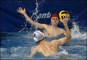 Robert DiSalle, St. John's, shoots at Zach Mercer, of Southview, during water polo practice at Northview High School pool.