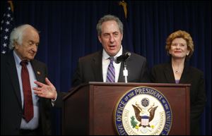 U.S. Trade Representative Mike Froman, Rep. Sander Levin, D-Mich., and Sen. Debbie Stabenow, D-Mich., speak to reporters.