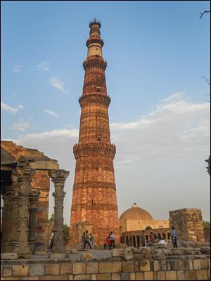 The 1,000-year-old Qutab Minar rises 237 feet above the surrounding ruins in Delhi.
