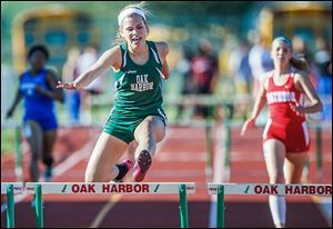 Oak Harbor's Alexa Weis wins the 300 meter hurdles during the Division II district track meet.