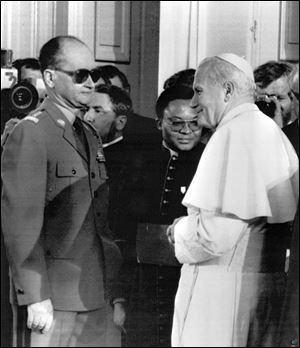 Pope John Paul II meets with Polish premier Wojciech Jaruzelski in this 1983 file photo at Belvedere Palace in Warsaw.