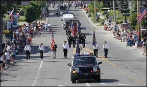 The Sylvania Memorial Day parade is lead by a Sylvania Police vehicle and a color guard with members from the American Legion Joseph W. Diehn Post 468 and the Veterans of Foreign Wars Remagen Bridge Post 3717. 