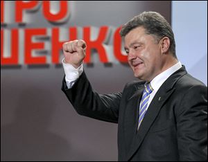 An exit poll showed that billionaire candy-maker Petro Poroshenko won Ukraine's presidential election outright Sunday in the first round — a vote that authorities hoped would unify the fractured nation.