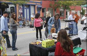 People enjoy the 9th annual Wander the Warehouse District in downtown Toledo last September.