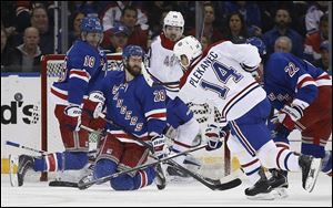 New York center Dominic Moore (28) and defenseman Marc Staal (18) block a shot by Montreal center Tomas Plekanec during the second period in Game 6 of the Eastern Conference finals on Thursday.