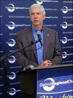 Gov. Rick Snyder speaks during the Mackinac Policy Conference today on Mackinac Island, Mich. Snyder is urging legislators to consider updating Michigan's civil rights law to prohibit discrimination because of sexual orientation or gender identity.