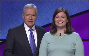 Alex Trebek, left, host of the TV show 