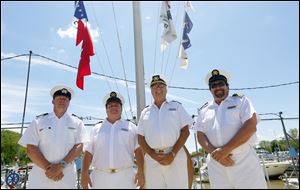 Commodores, from left: Jay Crum of Maumee River Yacht Club, Dan Maenle of Toledo Sailing Club, Tom Kaintz of Toledo Yacht Club, and Mark Gensler of Bay View Yacht Club enjoy the beautiful day during the Opening of the Port.