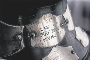 Engraving plates cover the base of The Toledo Blade Trophy, also called the Blade Cup.