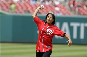 National Security Adviser Susan Rice throwing out the ceremonial first pitch before a baseball game between the New York Mets and the Washington Nationals at Nationals Park in Washington.