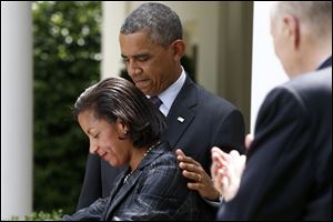 President Barack Obama standing with then-United Nations Ambassador Susan Rice, his choice to be his next National Security Adviser, as current National Security Adviser Tom Donilon, right, applauds in the Rose Garden at the White House in Washington.