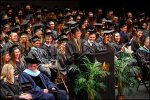 Alex Leong gives his valedictorian address Sunday during the 149th commencement ceremony for Perrysburg High School. The class of 2014 ended their high school careers at the Stranahan Theater.