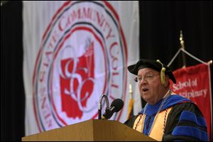 Owens Community College president Mike Bower delivers the opening remarks and welcome address during the 48th  annual spring commencement at Owens Community College in Perrysburg Township.