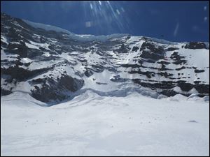 Six climbers missing on Mount Rainier are presumed dead after helicopters detected pings from emergency beacons buried in the snow thousands of feet below their last known location.