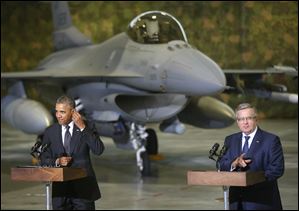President Obama and Poland's President Bronislaw Komorowski make statements and meet with U.S. and Polish troops at an event featuring four F-16 fighter jets, two American and two Polish, as part of multinational military exercises, in Warsaw, Poland, today.