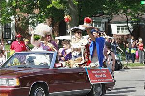 The King Wamba Parade stirs up excitement at the beginning of the festival. Here Sara Skow, left,  is Queen Sancha and Marc Folk is King Wamba for the 2013 Old West End festival parade.