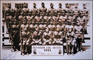 In this photo provided by the Nez family, Chester Nez, standing front left, of Albuquerque, N.M., poses with the first group of Navajo code talkers in 1942 in San Diego.  