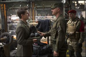 Tom Cruise and Bill Paxton in a scene from ‘Edge of Tomorrow.’