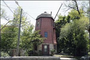 The exterior of the windmill apartment is shown on Clough Street in Bowling Green. The landmark, built in 1939, has accommodated renters in its cozy quarters since at least 1950.