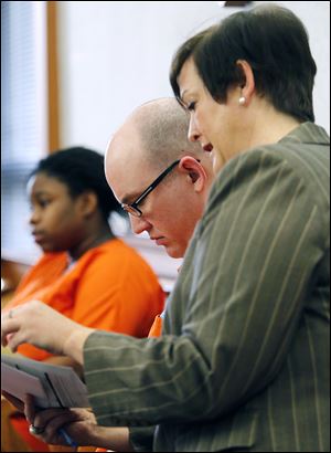 Anthony Bertolina, 34, and his attorney, Gretchen DeBacker, await his sentencing in Lucas County Common Pleas Court. He got life in prison with the possibility of parole after 30 years for the aggravated murder of his mother, Mary Bertolina, 56, in her South Toledo home on Dec. 9. She was stabbed to death.