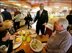 Carnival Corp. CEO Arnold Donald talks with passengers aboard the Carnival Splendor cruise ship as he takes over a troubled, family-run business and trying to convert the world’s largest cruise line into a profitable venture. The past two years have been troublesome for the cruise line.