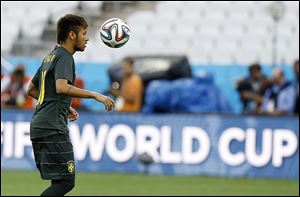A member of Brazil's soccer team practices in Sao Paulo, where World Cup play will begin  today.