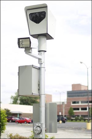 A red light speed camera sits near Cherry Street and Delaware Avenue in Toledo.  This is the second time the Ohio Supreme Court will consider the constitution-ality of the program.