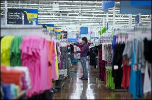Chelsea Vick shops for clothes at Wal-Mart Supercenter in Rogers, Ark.