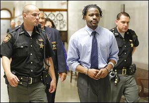 Deitrekk Boone, 21, is led into Lucas County Common Pleas Court. Judge James Bates made his decision after closing arguments. 