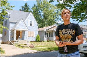For the last two years, when Tiffany Bolczak, 26, looks out the kitchen window of her Talbot Street home in West Toledo, she sees a boarded up, vacant house. ‘It’s really terrible,’ she says.