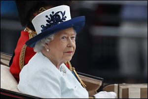 Britain's Queen Elizabeth II, leaves Buckingham Palace in a horse drawn carriage to attend the Trooping the Colour parade today in central London.