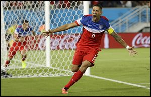 Clint Dempsey celebrates after scoring in the first minute of a World Cup match Monday against Ghana in Natal, Brazil. Ghana had eliminated the Americans in the last two World Cups.
