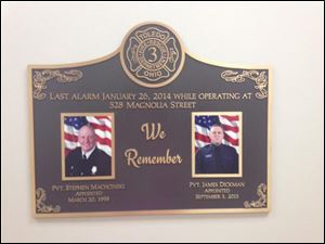 A plaque honoring fallen Toledo firemen Steve Machcinski and James Dickman hangs in the newly renovated Station No. 3.